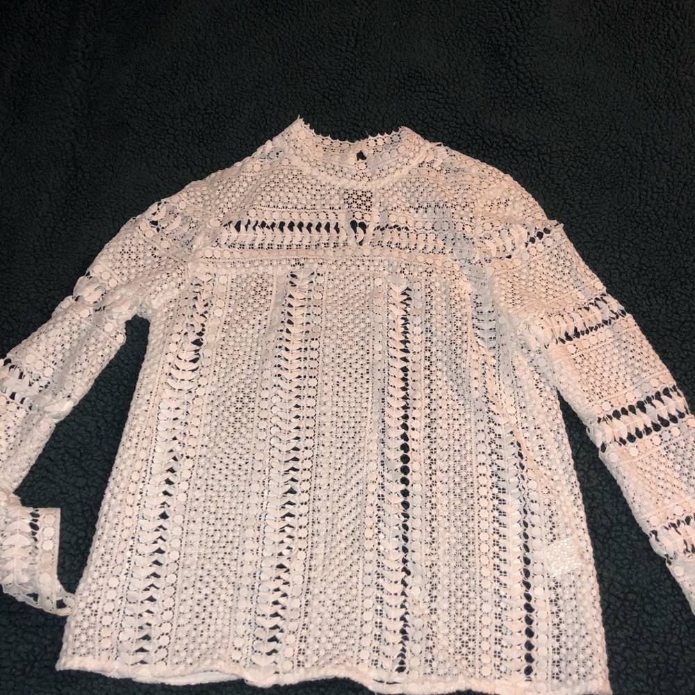 White patterned high neck top.